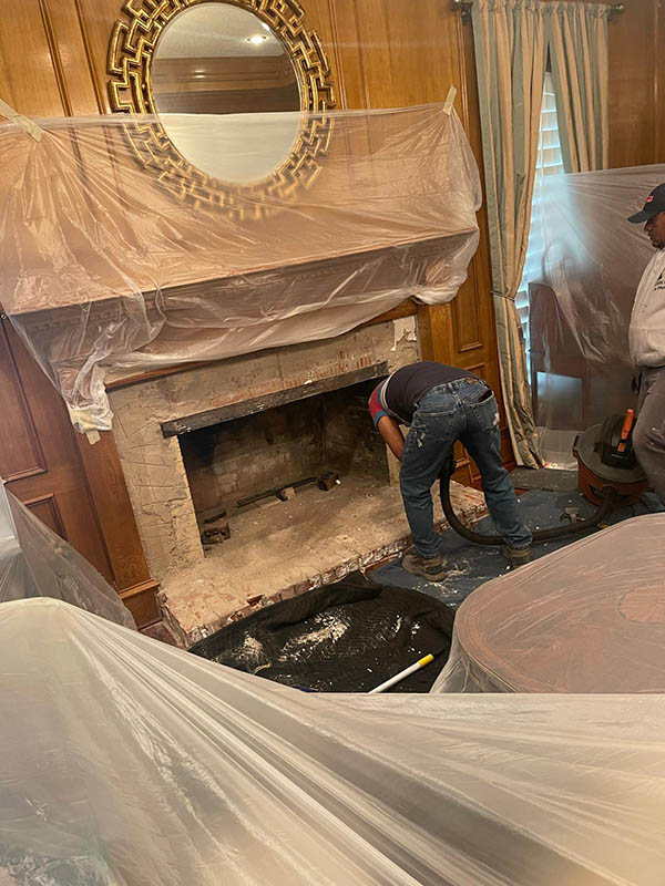 Arlington contractors cleaning fireplace